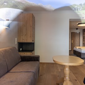 Skihotel: Wohnbereich Junior Suite Typ C - stefan Hotel