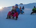 Skigebiet: Rodeln auf der längsten beleuchteten Rodelbahn der Welt - Wildkogel-Arena Neukirchen & Bramberg