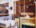 Skihotel: Badezimmer & Sauna | Bathroom & Sauna - Stockinggut by AvenidA | Hotel & Residences