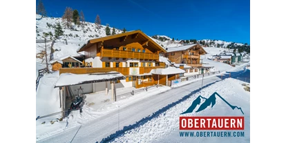 Hotels an der Piste - Trockenraum - Obertauern - Ferienwohnungen Petergstamm in Obertauern, mitten im Winter, Pisten fußläufig in 1 Minute erreichbar. Genießen Sie den Traum der Tauernrunde. - Appartementhaus Petergstamm