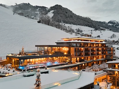 Hotels an der Piste - Mallnitz - Außenansicht Winter - DAS EDELWEISS Salzburg Mountain Resort