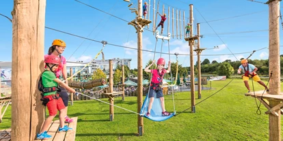 Hotels an der Piste - Köln, Bonn, Eifel ... - SalzburgerLand Kletterpark Neuss -   7 Parcours bieten Herausforderungen unterschiedlichster Art zwischen 3 und 9 Metern Höhe - Hotel Fire & Ice Düsseldorf/Neuss
