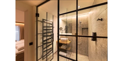 Hotels an der Piste - Skiverleih - Bad- Doppelzimmer Träumerei Deluxe - Aktivhotel Alpendorf