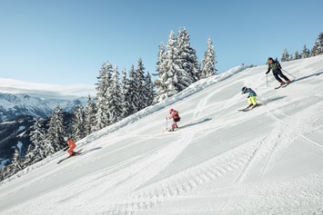 Skihotel: Skifahren mit der Familie auf der Schmittenhöhe in Zell am See - Hotel Sonnblick