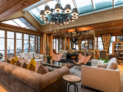Hotels an der Piste - PLZ 6373 (Österreich) - Wintergarten | Wohnzimmer - Hotel Gassner****Superior