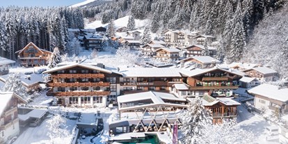 Hotels an der Piste - Hotel-Schwerpunkt: Skifahren & Familie - Außenansicht ****s Hotel Gassner und Gassner Baumhaus - Wander- & Wellnesshotel Gassner****s