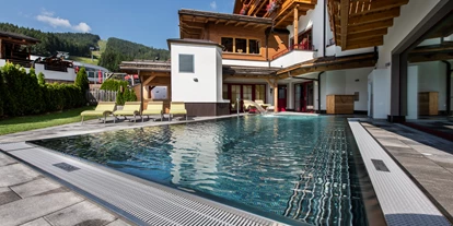 Hotels an der Piste - Skiverleih - Outdoorpool - Grizzly Sport & Motorrad Resort