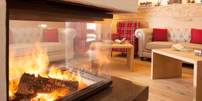 Hotels an der Piste - Skiverleih - Hotel Nassfeld Kamin Lounge - Hotel Nassfeld