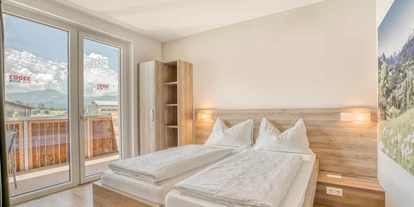 Hotels an der Piste - Verpflegung: Halbpension - Itter - Standard Zimmer - COOEE alpin Hotel Kitzbüheler Alpen