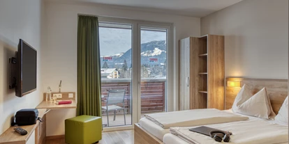 Hotels an der Piste - Verpflegung: Halbpension - Itter - Standard Zimmer - COOEE alpin Hotel Kitzbüheler Alpen