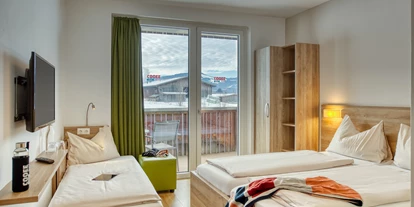 Hotels an der Piste - Verpflegung: Halbpension - Itter - Extrabett im Standard Zimmer - COOEE alpin Hotel Kitzbüheler Alpen