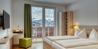 Hotels an der Piste - Verpflegung: Halbpension - Itter - Apfeldorf Zimmer - COOEE alpin Hotel Kitzbüheler Alpen