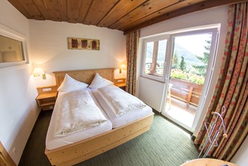Skihotel: Junior Suite "Enzian Stube" Schlafzimmer - Hotel Berghof