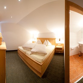Skihotel: Schlafzimmer Suite "Nockberge - Hotel Berghof