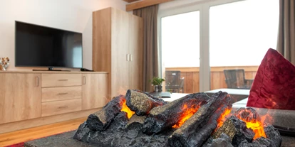 Hotels an der Piste - Skiraum: vorhanden - Unterlangkampfen - Symbolfoto Wohnzimmer Familienappartement / Zimmer Lahnerköpfl Alpine Lodge  - Hotel Wastlhof