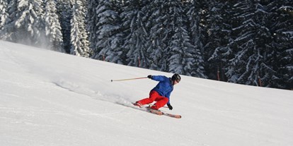 Hotels an der Piste - Skikurs direkt beim Hotel: eigene Skischule - Schneesicherer Carving-Spaß - Familienhotel Berger ***superior