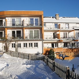 Skihotel: Gartenansicht im Winter - Familienhotel Berger ***superior