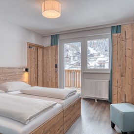 Skihotel: Familienzimmer - COOEE alpin Hotel Bad Kleinkirchheim