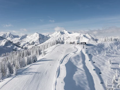 Hotels an der Piste - PLZ 6373 (Österreich) - Skicircus Saalbach Hinterglemm Leogang Fieberbrunn © saalbach.com, Christian Wöckinger - 4****S Hotel Hasenauer