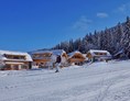 Skihotel: Trattlers Hof-Chalets direkt an der Piste - Trattlers Hof-Chalets
