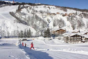 Skihotel: Skischulübungsgelände vis à vis vom Hotel - Erstklassig & down to Earth - das bio-zertifizierte Gartenhotel Theresia****S 